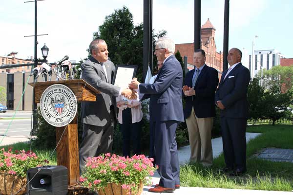 Binghamton Mayor Richard David presents Security Mutual Week Proclamation to Security Mutual Chairman and CEO Bruce W. Boyea.