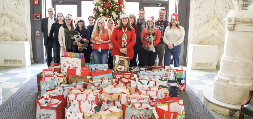 Security Mutual Employees with Giving Tree Gifts for local children